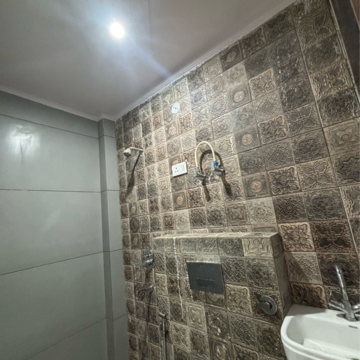 Bathroom in 4 BHK Builder Floor at Dwarka Mor – for Rent