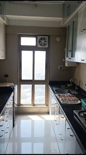 Kitchen in 2 BHK Apartment at Sheth Vasant Oasis, Andheri East – for Rent