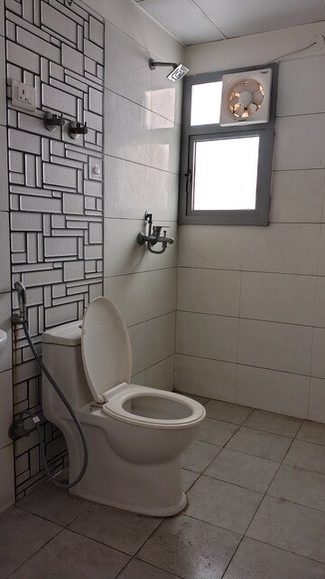 Bathroom in 3 BHK Apartment at Gulshan Bellina, Sector 16 Greater Noida – for Rent