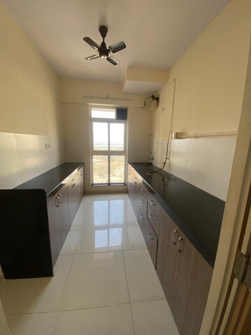 Kitchen in 2 BHK Apartment at Godrej Emerald, Ghodbunder Road – for Rent