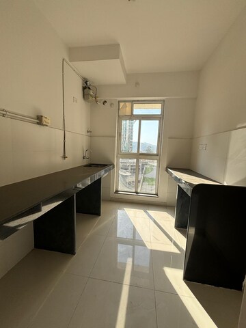 Kitchen in 1.5 BHK Apartment at Godrej Emerald, Ghodbunder Road – for Sale