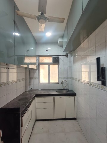 Kitchen in 1 BHK Apartment at Evershine CHS Malad, Malad West – for Rent