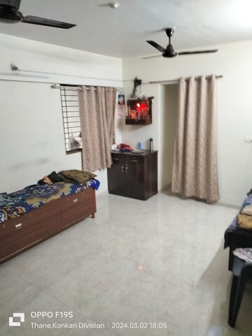 Living Room in 1 BHK Apartment at Lodha Palava City Lakeshore Greens, Dombivli East – for Sale