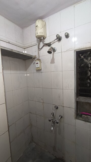 Bathroom in 1 BHK Apartment at Dak Sangathan CHS, Malad East – for Rent