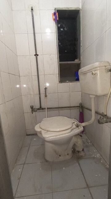 Bathroom in 1 BHK Apartment at Dak Sangathan CHS, Malad East – for Rent