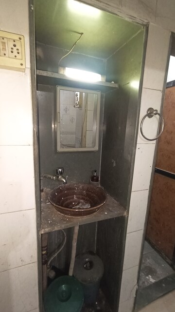 Bathroom in 1 BHK Apartment at Dak Sangathan CHS, Malad East – for Rent