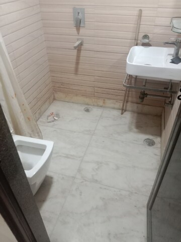 Bathroom in 2 BHK Apartment at Rohini Sector 18 – for Rent