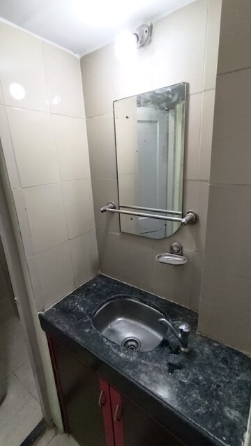 Bathroom in 1 BHK Apartment at Sunrise CHS Mhada, Goregaon East – for Rent