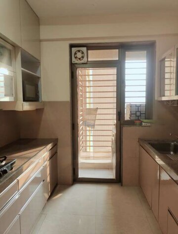 Kitchen in 2.5 BHK Apartment at T Bhimjyani Neelkanth Woods Olivia, Ghodbunder Road – for Rent