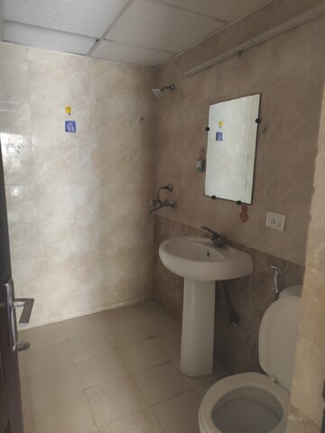 Bathroom in 3.5 BHK Apartment at Aims Golf City, Sector 75 – for Rent