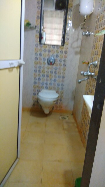 Bathroom in 2 BHK Apartment at Neptune CHS Andheri West, Andheri West – for Sale