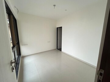 Master Bedroom in 1 BHK Apartment at Chandak Nishchay Wing B, Borivali East – for Sale