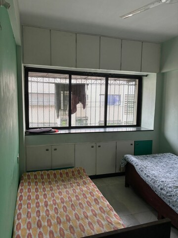 Bedroom in 2 BHK Apartment at Satellite Garden, Goregaon East – for Rent