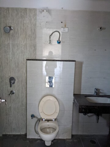 Bathroom in 4 BHK Apartment at Hanumant Bollywood Heights-2, Dhakoli Village – for Sale