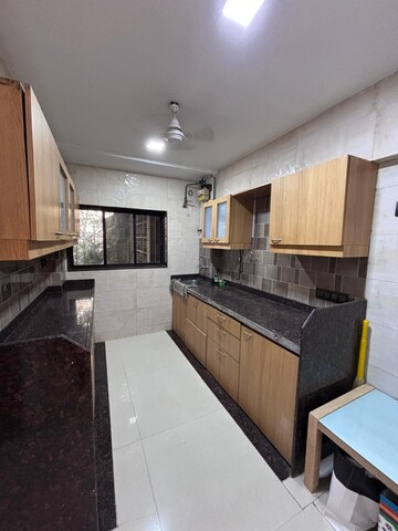 Kitchen in 2 BHK Apartment at Transcon Flora Heights, Andheri West – for Rent