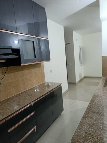 Kitchen in 3 BHK Apartment at Pardos Okas Residency, Sushant Golf City – for Sale