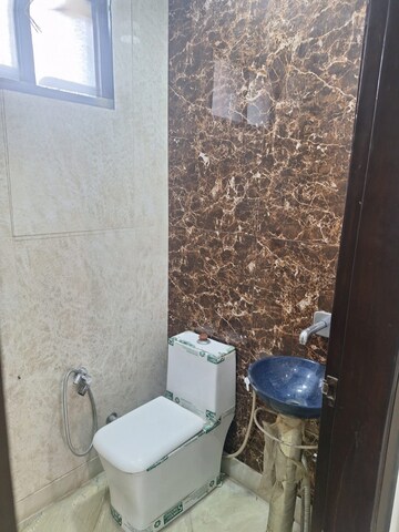 Bathroom in 2 BHK Apartment at Rohini Sector 18 – for Rent