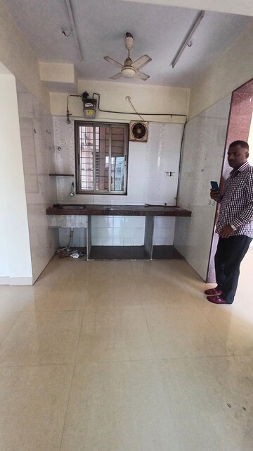 Kitchen in 1.5 BHK Apartment at Prabhat Upvan CHS, Gawand Baug – for Rent