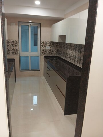 Kitchen in 3 BHK Apartment at Relliance Lashkaria Solitaire, Andheri West – for Sale