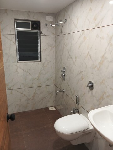 Bathroom in 3 BHK Apartment at Relliance Lashkaria Solitaire, Andheri West – for Sale