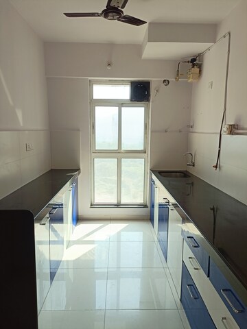 Kitchen in 3 BHK Apartment at Godrej Emerald, Ghodbunder Road – for Sale