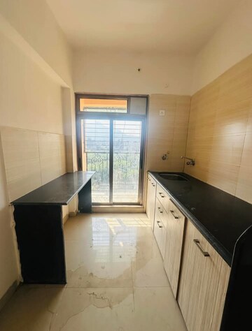 Kitchen in 1 BHK Apartment at Pranjee Garden City, Katrap – for Sale