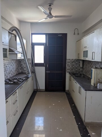 Kitchen in 4 BHK Apartment at Hanumant Bollywood Heights-2, Dhakoli Village – for Sale