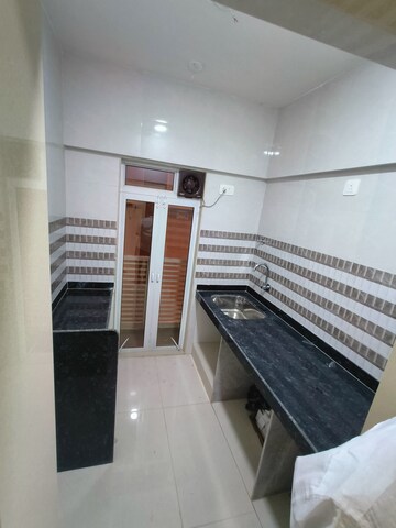Kitchen in 1 BHK Apartment at Satyam CHS Naupada, Naupada – for Rent