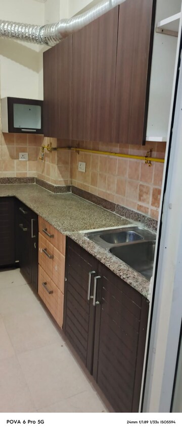 Kitchen in 2 BHK Apartment at Amrapali Eden Park, Sector 50 – for Rent