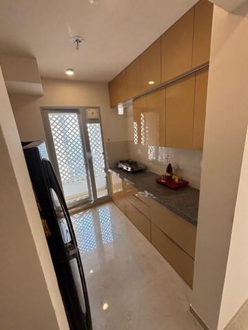 Kitchen in 2 BHK Apartment at Piramal Vaikunth, Balkum Pada – for Rent
