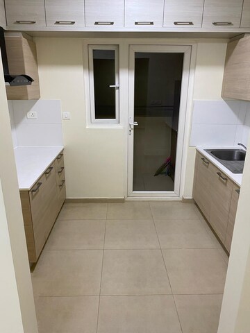 Kitchen in 2 BHK Apartment at Bhartiya Nikoo Homes, Thanisandra Main Road – for Rent