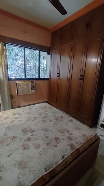 Bedroom in 2 BHK Apartment at Ajit Park CHS, Malad West – for Rent