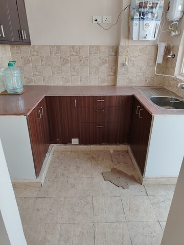 Kitchen in 2 BHK Apartment at Amrapali Golf Homes, Sector 4, Greater Noida – for Rent