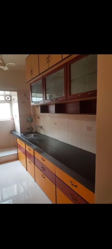 Kitchen in 2 BHK Apartment at Palace Orchard CHS, Mohammadwadi – for Rent