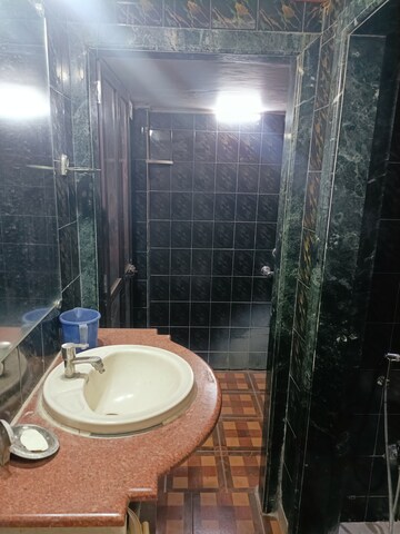 Bathroom in 1 BHK Apartment at Brahmand CHS, Brahmand – for Sale