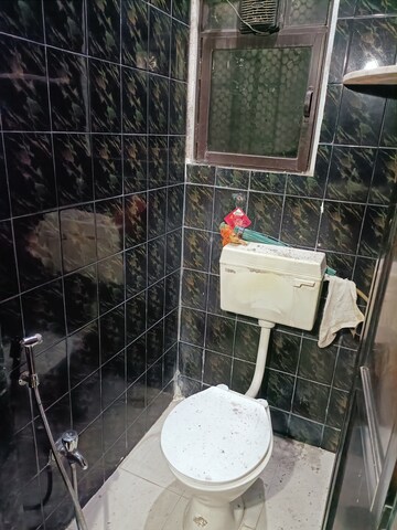 Bathroom in 1 BHK Apartment at Brahmand CHS, Brahmand – for Sale