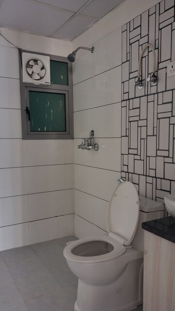 Bathroom in 2.5 BHK Apartment at Gulshan Bellina, Sector 16 Greater Noida – for Rent