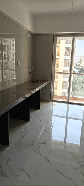 Kitchen in 3 BHK Apartment at Naupada – for Sale