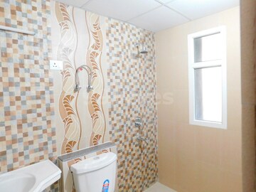 Bathroom in 1 RK Apartment at Purvanchal Royal City, Chi V Greater Noida – for Rent