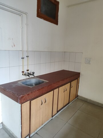 Kitchen in 1 RK Villa at RWA Apartments Sector 27, Sector 27 – for Rent
