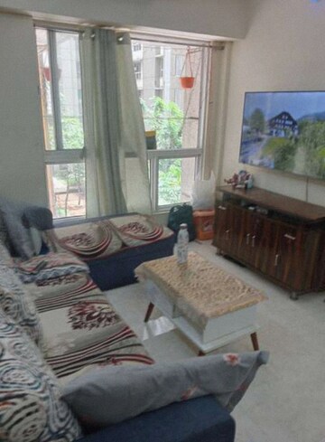 Living Room in 1 BHK Apartment at Lodha Amara, Kolshet Road – for Rent