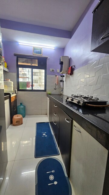 Kitchen in 1.5 BHK Apartment at RNA NG Canary, Mira Road – for Rent