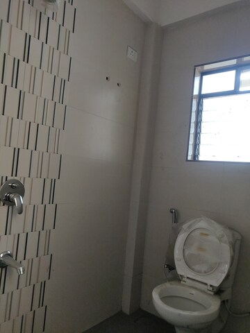 Bathroom in 1 BHK Apartment at Happy Sarvoday Greens, Bhadwad Gaon – for Sale