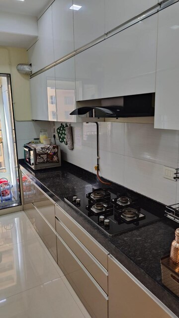 Kitchen in 2 BHK Apartment at Rustomjee Urbania Azziano, Majiwada – for Sale