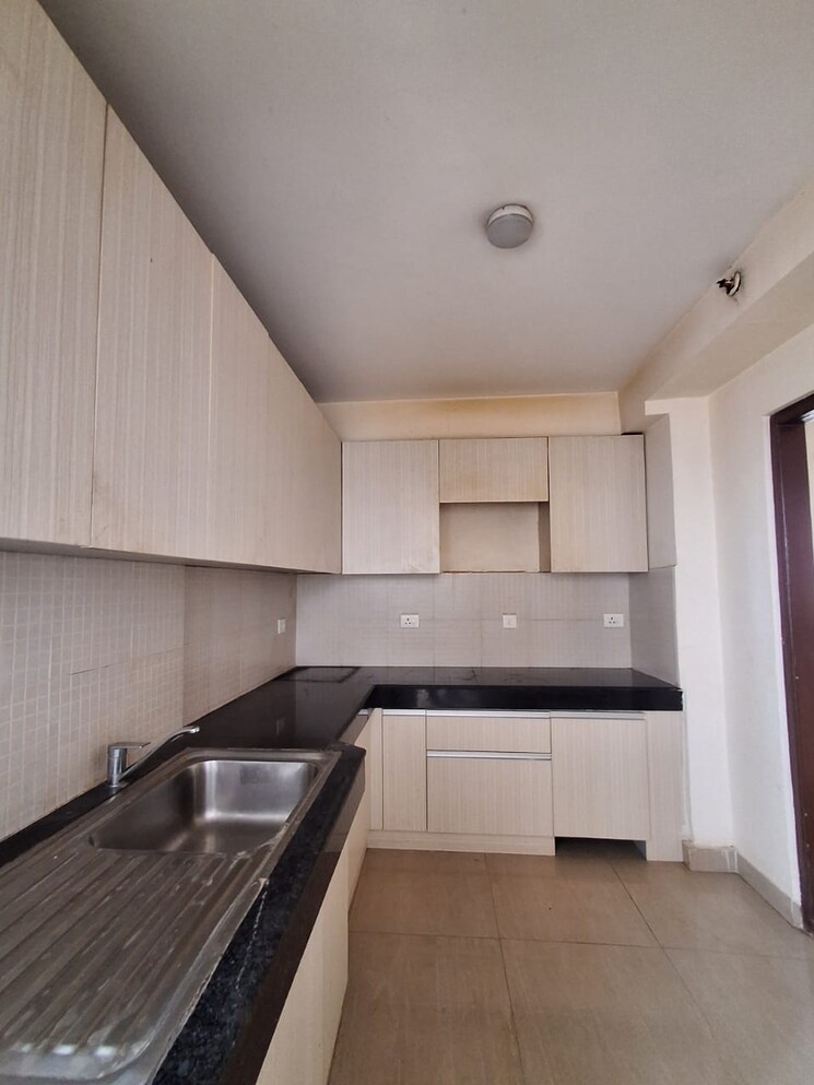 Kitchen, shapoorji-pallonji-joyville-phase-2 3 Bedroom 1852 Sq.Ft. Apartment In Sector 102 Gurgaon 8164076