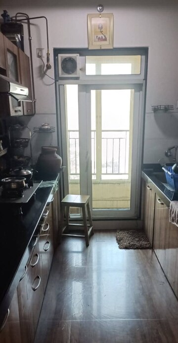 Kitchen in 2 BHK Apartment at Rustomjee Urbania Azziano, Majiwada – for Rent