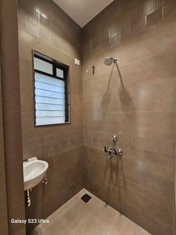 Bathroom in 1 BHK Apartment at Venkatesha Apex Paradise, Vadghar – for Sale