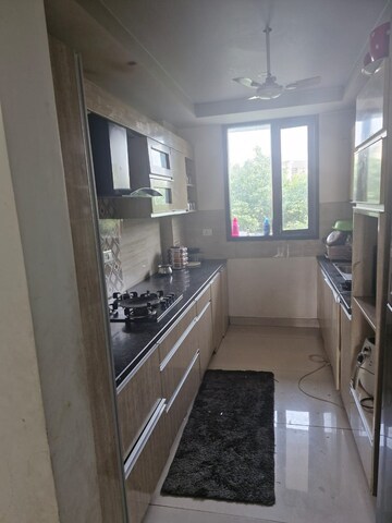 Kitchen in 3 BHK Builder Floor at Ansal API Esencia, Sector 67 – for Sale