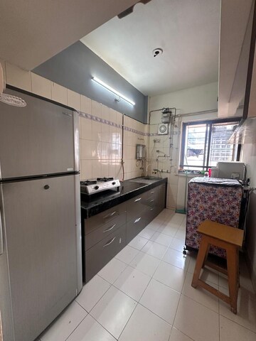 Kitchen in 2 BHK Apartment at Raheja Woods, Kalyani Nagar – for Rent