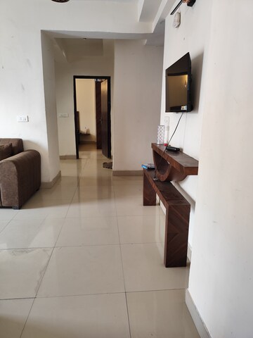 Living Room in 2 BHK Apartment at Aims Golf City, Sector 75 – for Rent